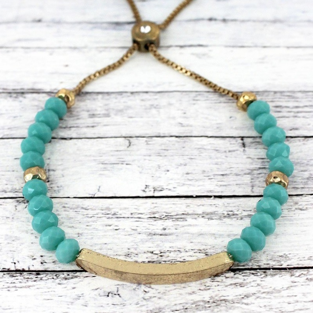 TURQUOISE FACETED BEAD & GOLDTONE BAR BOLO